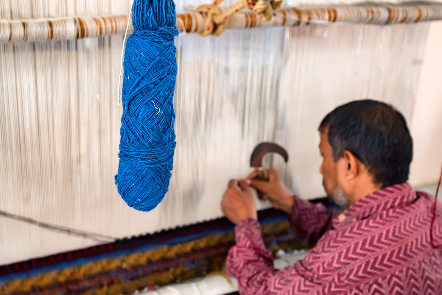 Artisan making Rug
